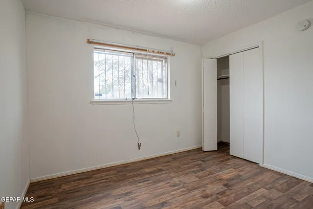a bathroom with a double vanity sink toilet and a mirror