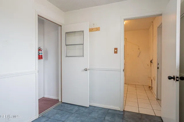 a white toilet sitting next to a shower