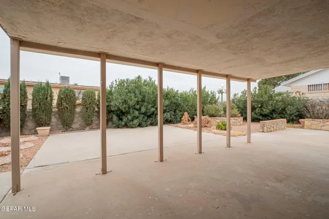 an aerial view of a house with yard