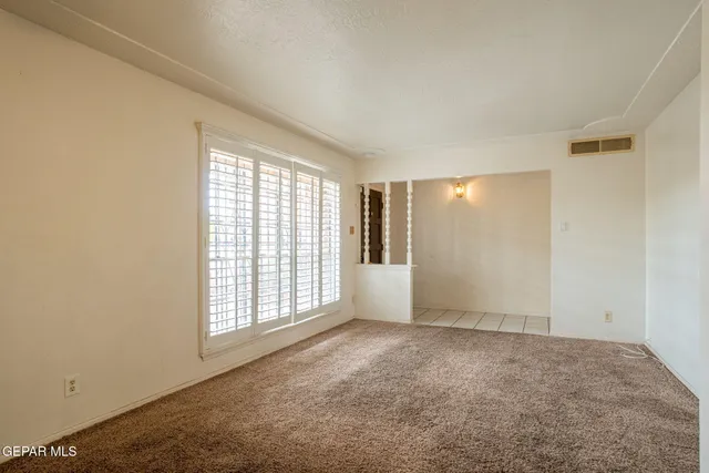 a kitchen with stainless steel appliances a refrigerator and cabinets
