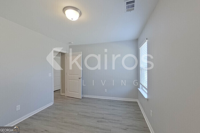 102 Colonial Way Springfield, GA 31329 - Photo 18 of 28 a view of a room with wooden floor