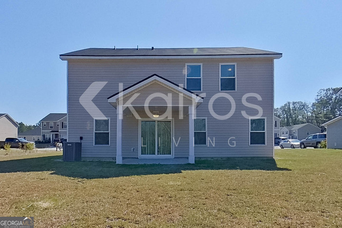 102 Colonial Way Springfield, GA 31329 - Photo 25 of 28 a front view of a house with garden