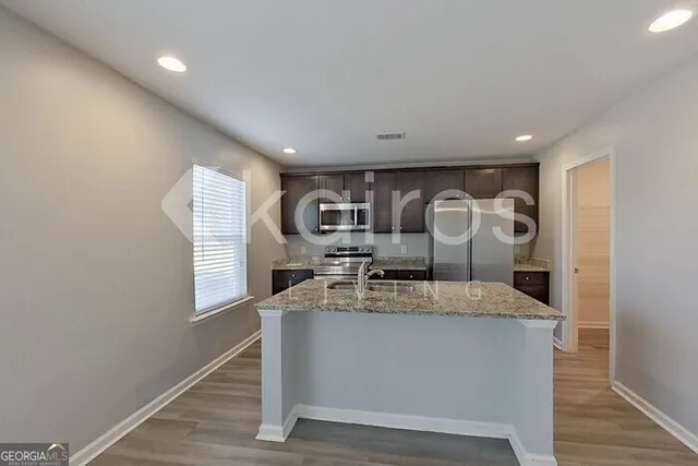 a large kitchen with a large window