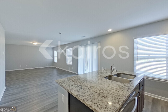 102 Colonial Way Springfield, GA 31329 - Photo 9 of 28 a kitchen with a sink a counter space and a stove