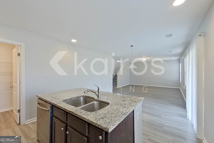 102 Colonial Way Springfield, GA 31329 - Photo 10 of 28 a bathroom with a granite countertop sink a mirror and vanity