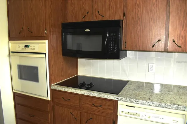a kitchen with a sink and a refrigerator