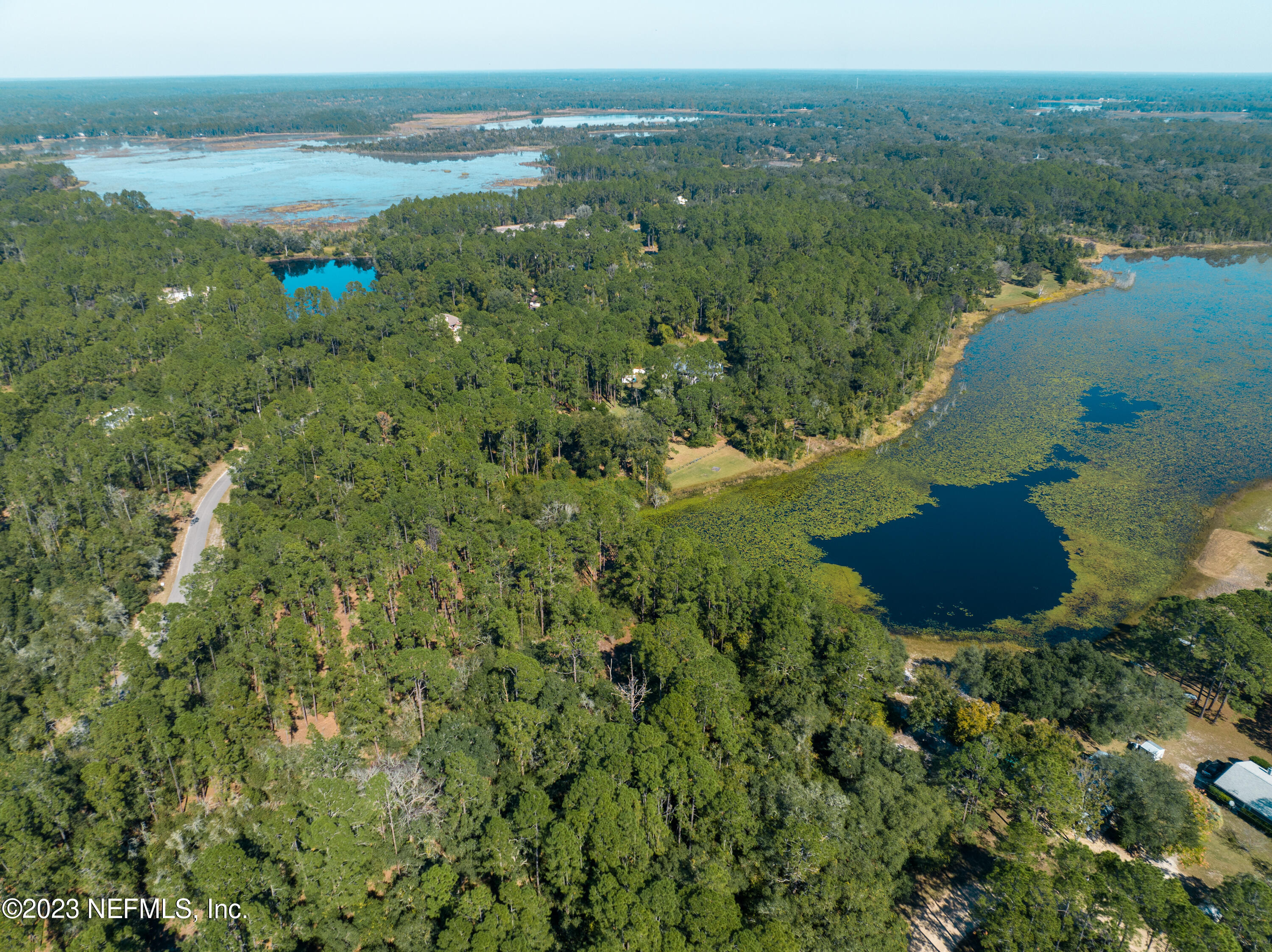 5495 Laredo Street Keystone Heights, FL 32656 - Photo 17 of 22 a view of a lake with a mountain in the background