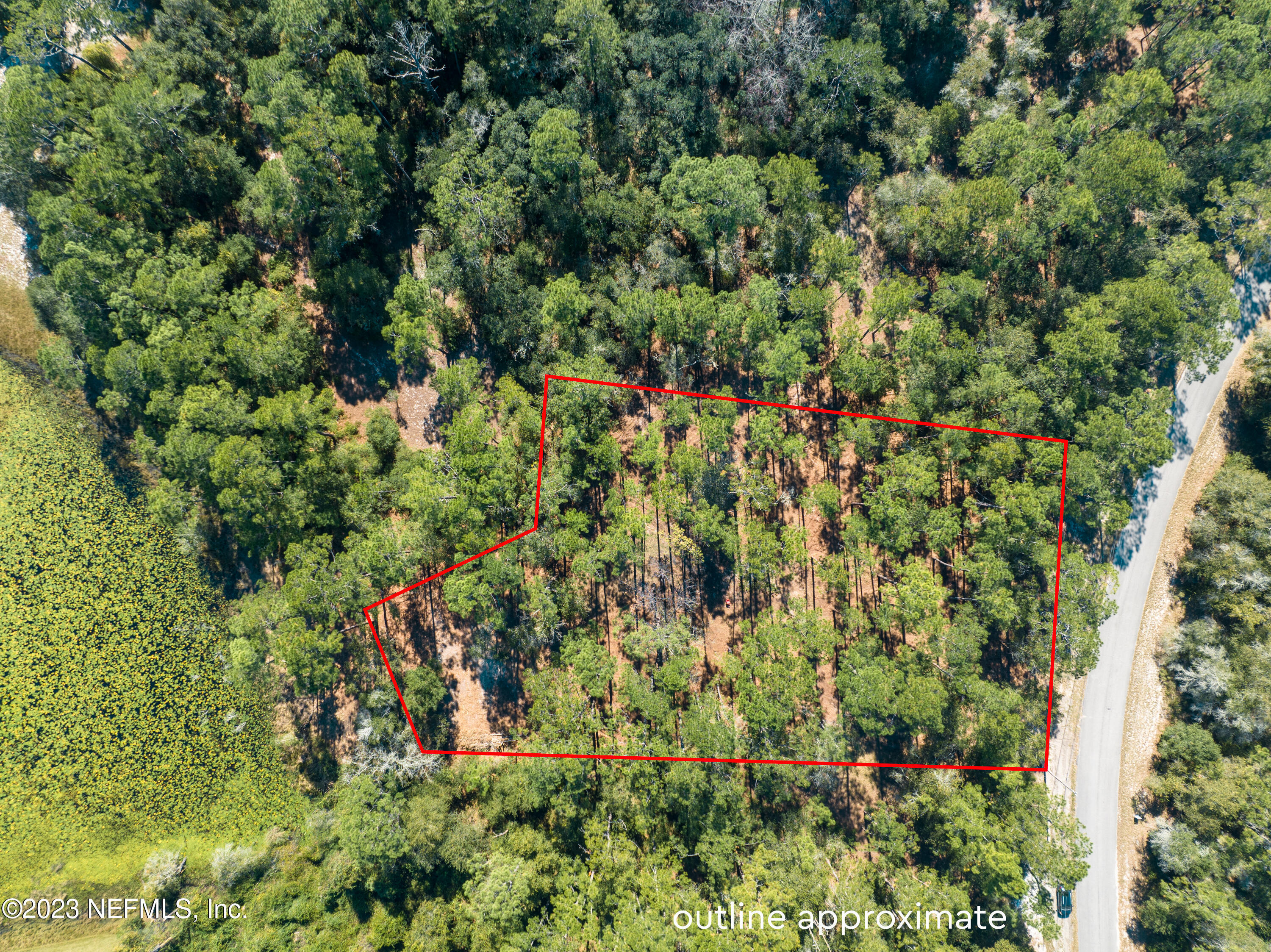 5495 Laredo Street Keystone Heights, FL 32656 - Photo 18 of 22 an aerial view of residential house with outdoor space and trees all around