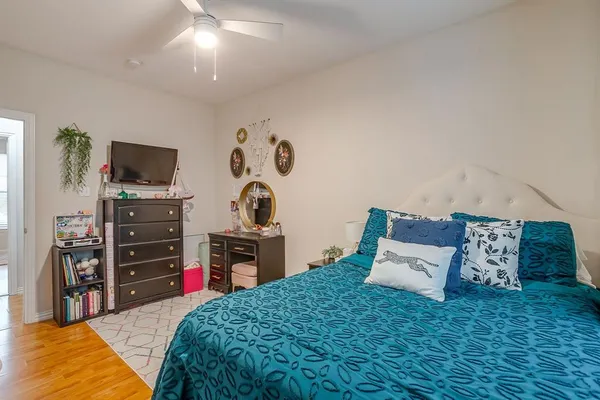 a bed room with a bed and a television