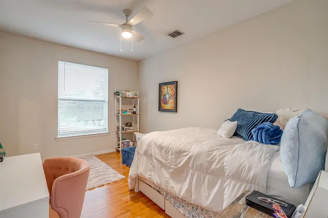 a bedroom with a bed furniture and a window
