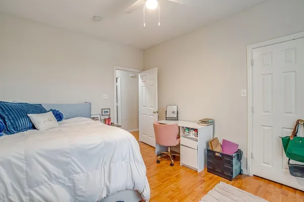 a bed room with a bed window and chair