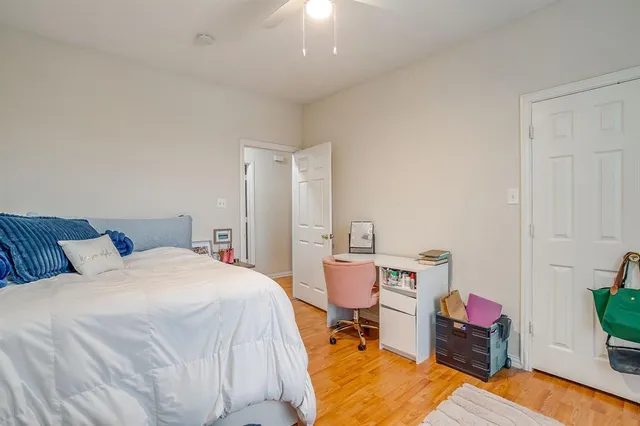 a bed room with a bed window and chair