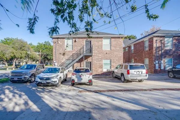 a view of a street with cars