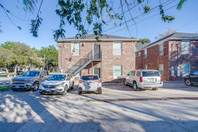 a view of a street with cars