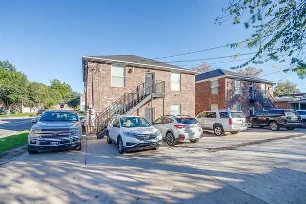 a view of a car park in front of house