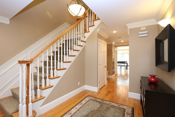 77 Woodledge Road Needham, MA 02492 - Photo 2 of 20 a view of entryway and hall with wooden floor