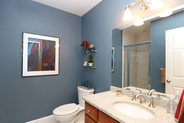 77 Woodledge Road Needham, MA 02492 - Photo 8 of 20 a bathroom with a granite countertop sink toilet and mirror