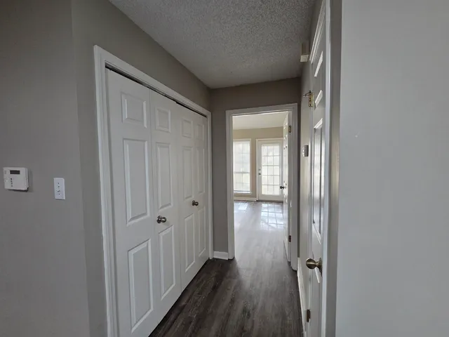 a view of a bathroom from the hallway
