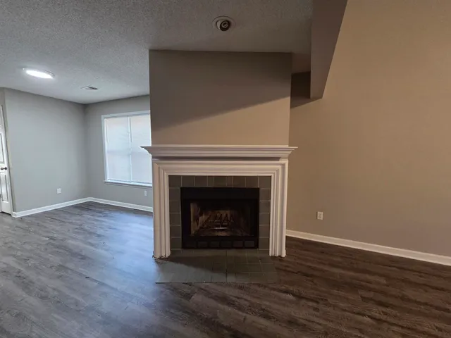 a living room with a fireplace