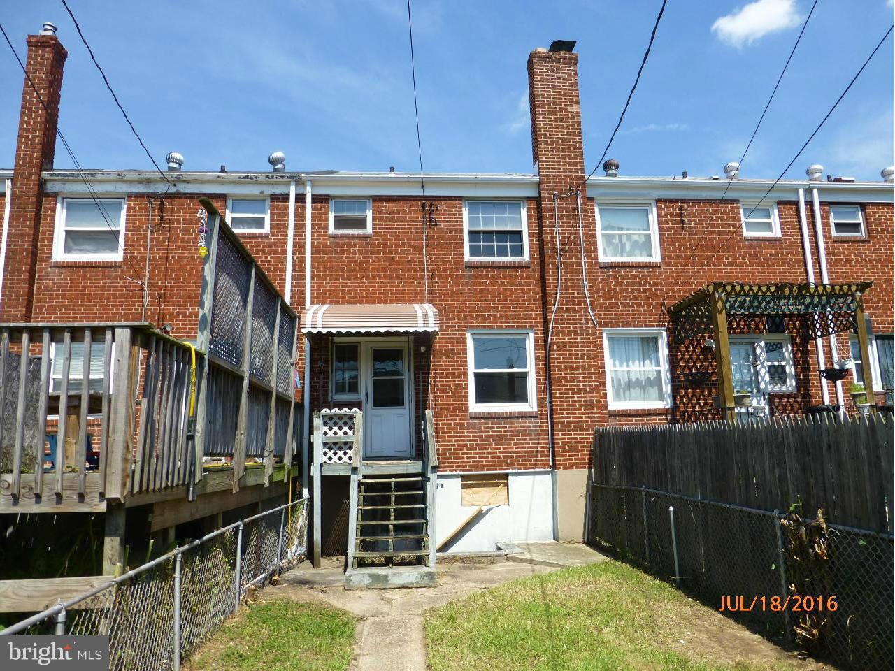 1933 Penhall Road Baltimore, MD 21222 - Photo 2 of 15 a front view of a house with parking