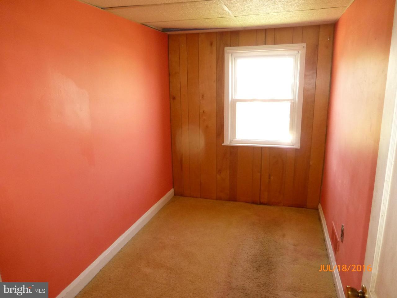 1933 Penhall Road Baltimore, MD 21222 - Photo 11 of 15 an empty room with a window
