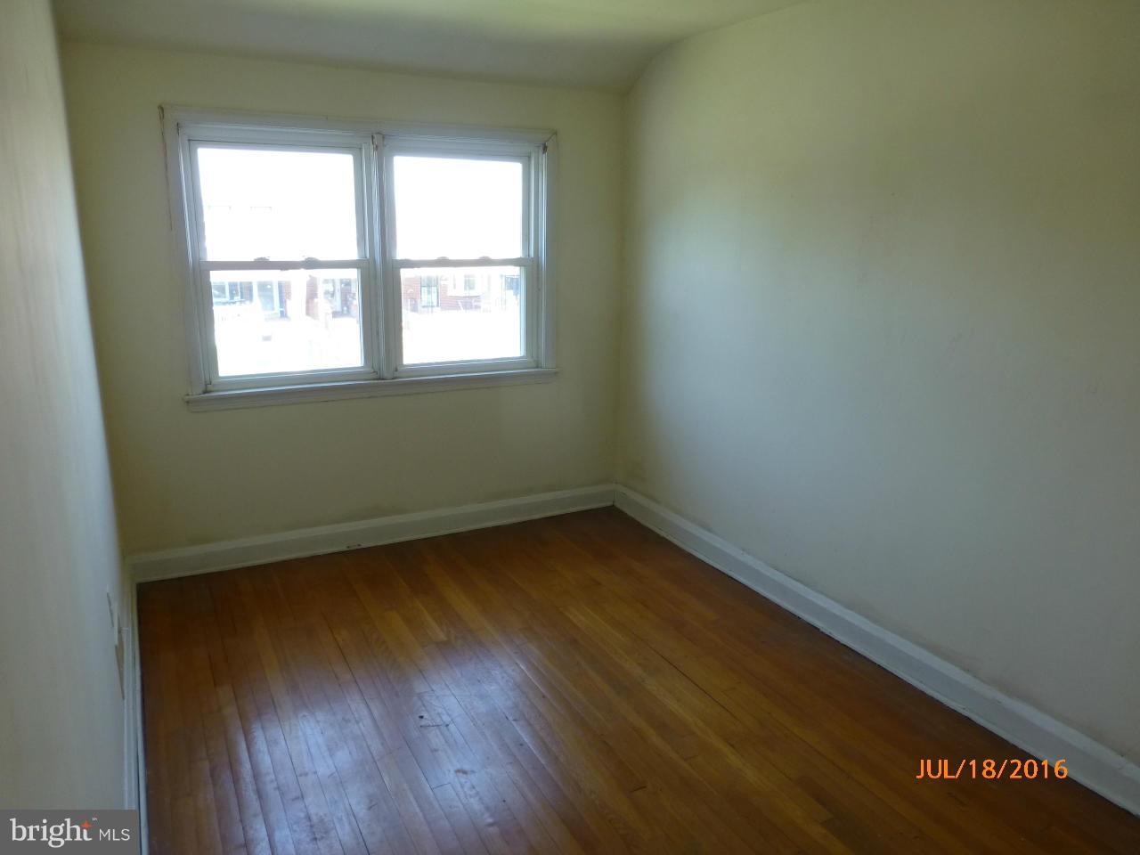 1933 Penhall Road Baltimore, MD 21222 - Photo 12 of 15 a view of a room with wooden floor and a window