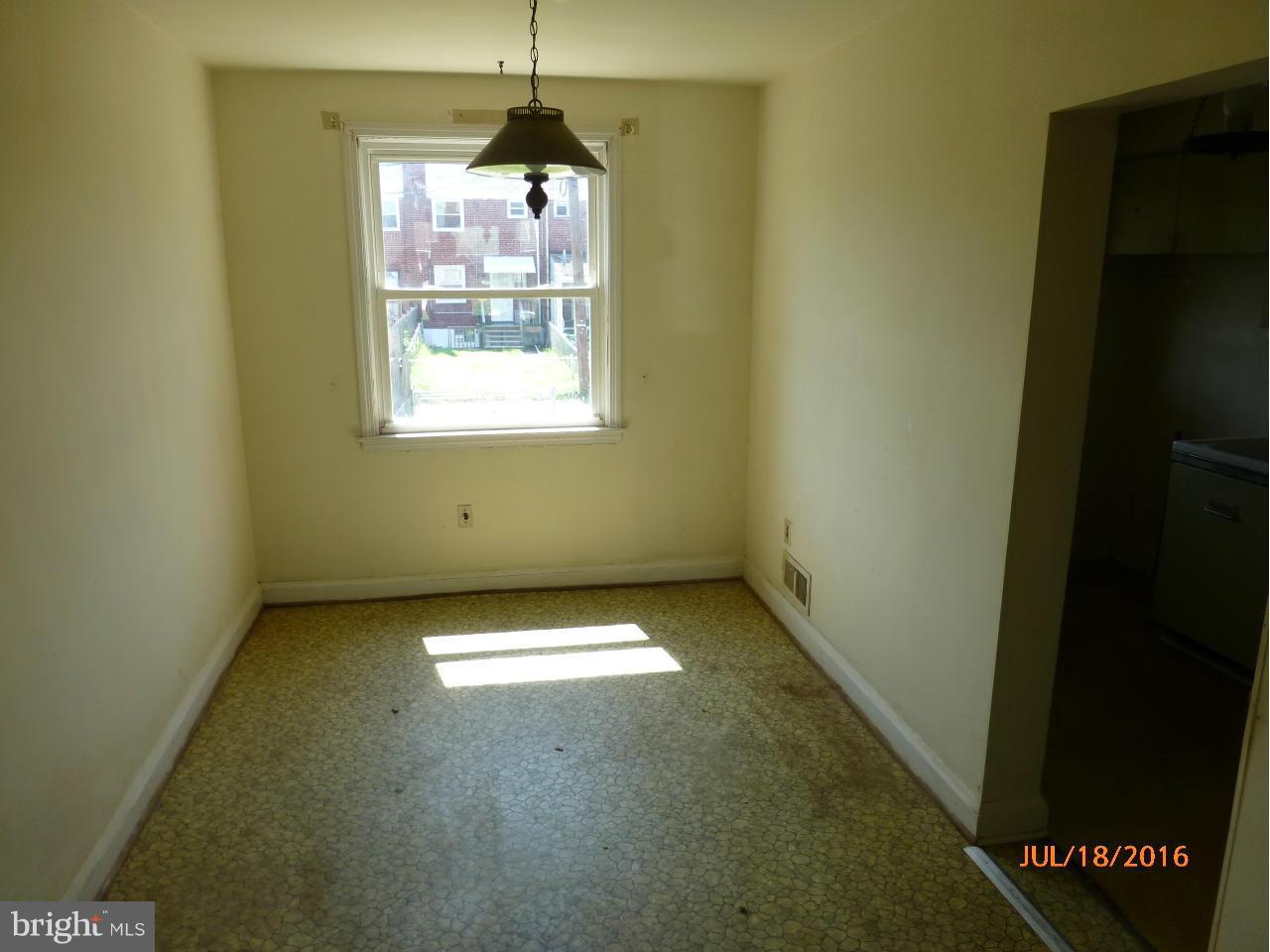 1933 Penhall Road Baltimore, MD 21222 - Photo 6 of 15 a view of an empty room with a window