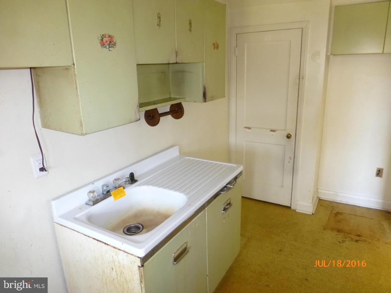 1933 Penhall Road Baltimore, MD 21222 - Photo 8 of 15 a bathroom with a sink and a mirror