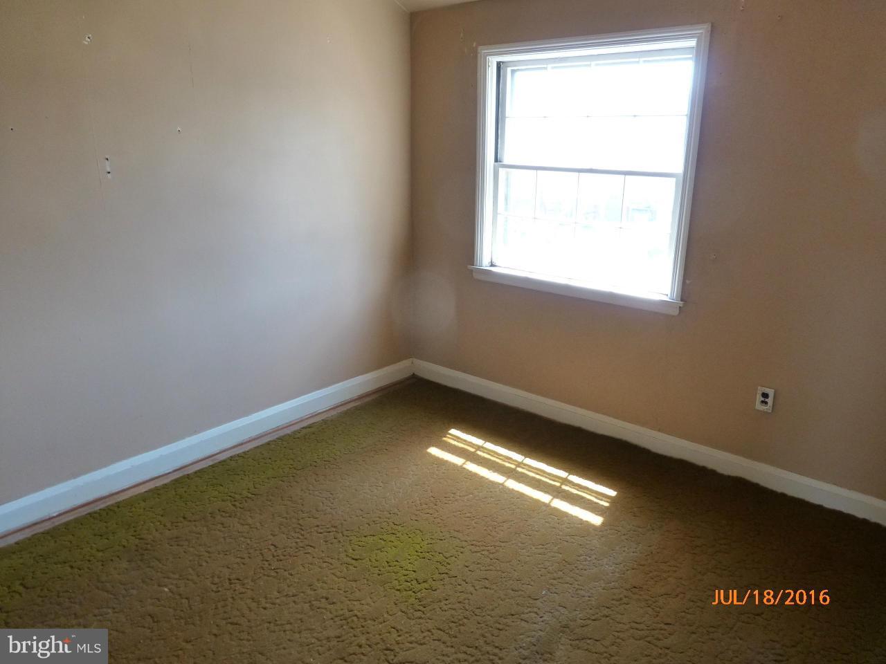 1933 Penhall Road Baltimore, MD 21222 - Photo 10 of 15 a view of an empty room with a window