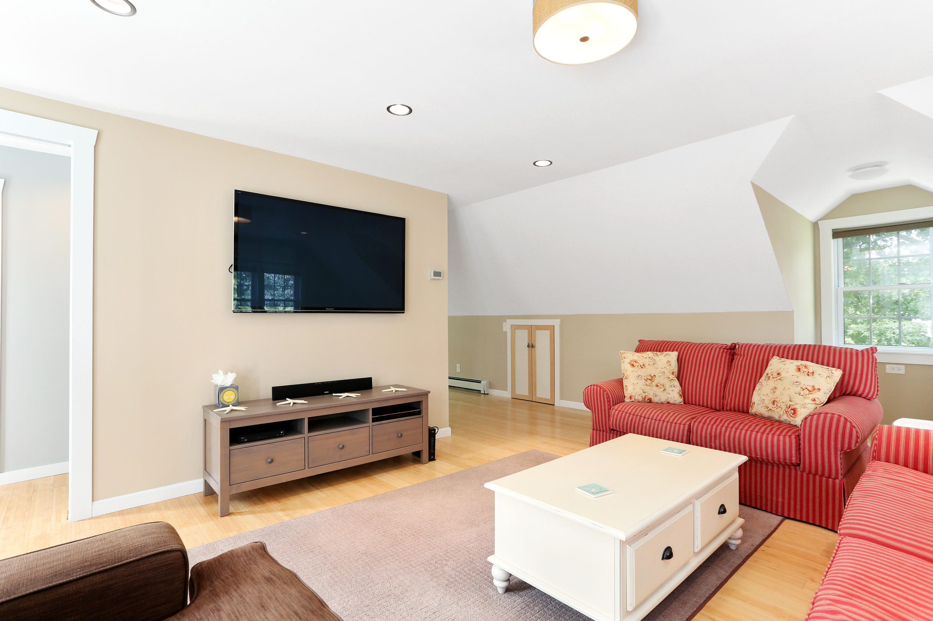 93 Brooks Road Harwich Port, MA 02646 - Photo 23 of 35 a living room with furniture and a flat screen tv