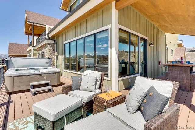 a view of a patio with couches and table and chairs