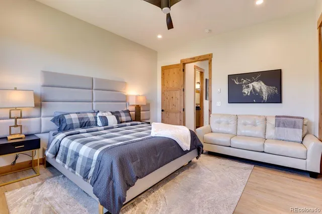 a bed room with a bed and a couch