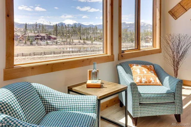 a view of a room with furniture and staircase