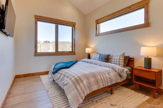 a bedroom with bed and a window