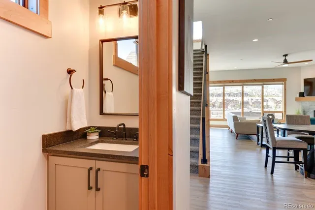 a en suite bathroom with a sink and a mirror