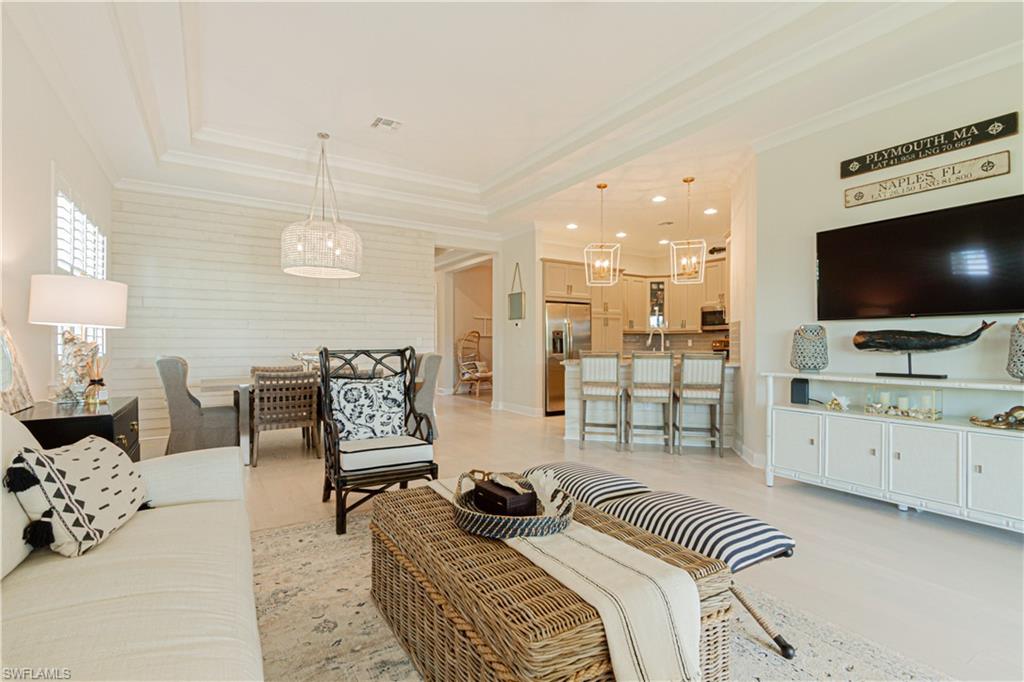 a bedroom with furniture and a flat screen tv