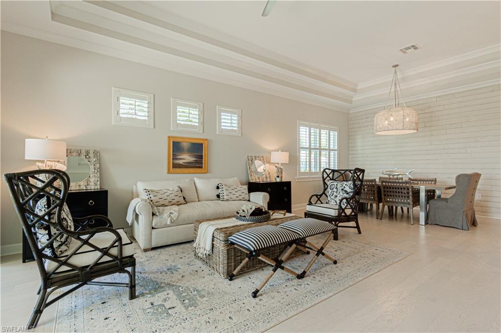 5834 Haiti Drive Naples, FL 34113 - Photo 12 of 33 a living room with furniture and a large window