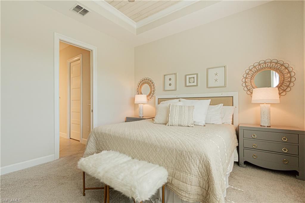 5834 Haiti Drive Naples, FL 34113 - Photo 14 of 33 a bedroom with a bed and a dresser