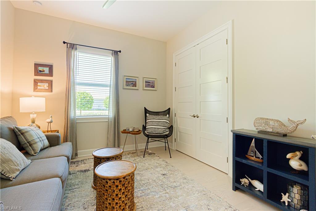 5834 Haiti Drive Naples, FL 34113 - Photo 16 of 33 a living room with furniture and a window