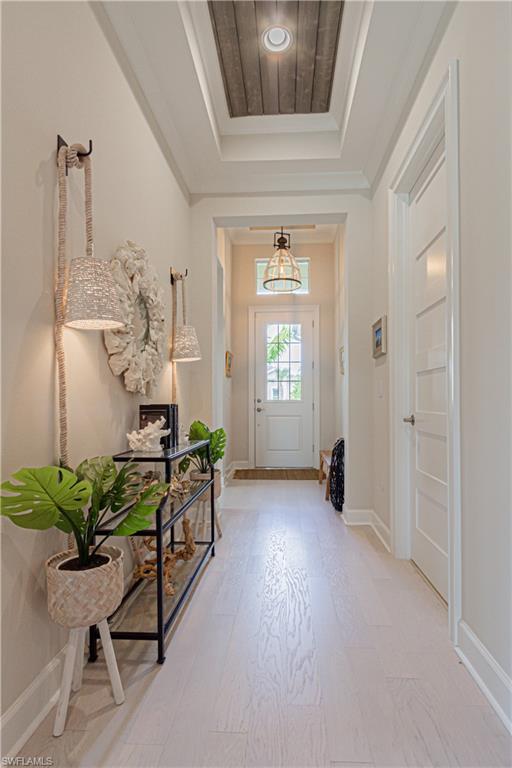 5834 Haiti Drive Naples, FL 34113 - Photo 2 of 33 a living room with furniture and a potted plant