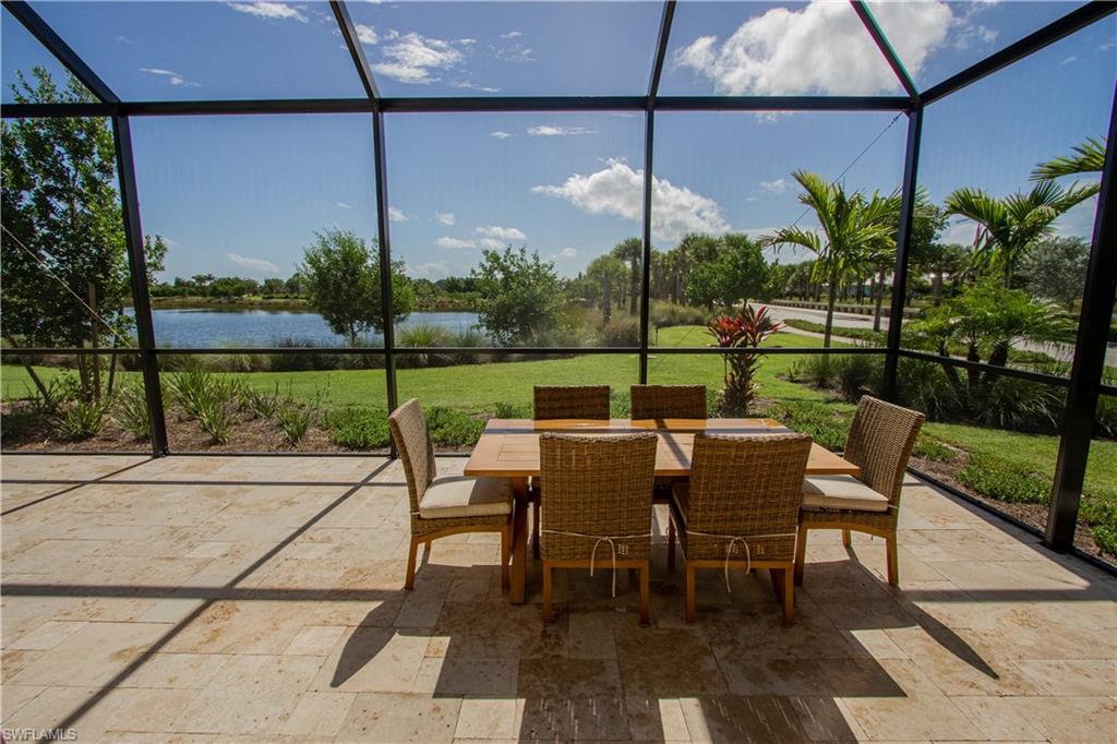5834 Haiti Drive Naples, FL 34113 - Photo 22 of 33 a view of a patio with table and chairs potted plants with wooden floor