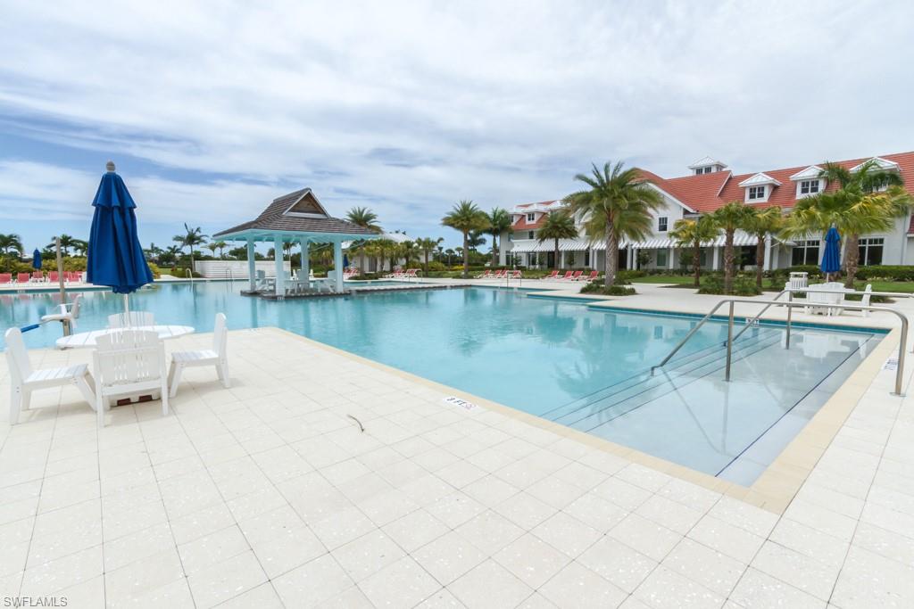 5834 Haiti Drive Naples, FL 34113 - Photo 29 of 33 a view of a swimming pool and a terrace