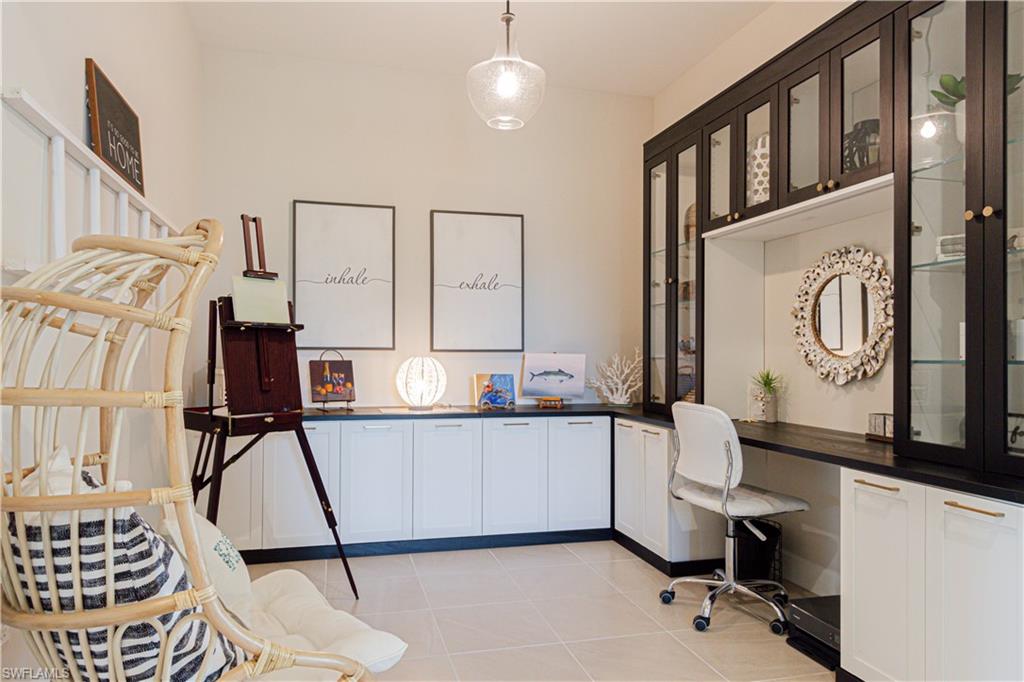 5834 Haiti Drive Naples, FL 34113 - Photo 4 of 33 a view of hall way with furniture and chandelier