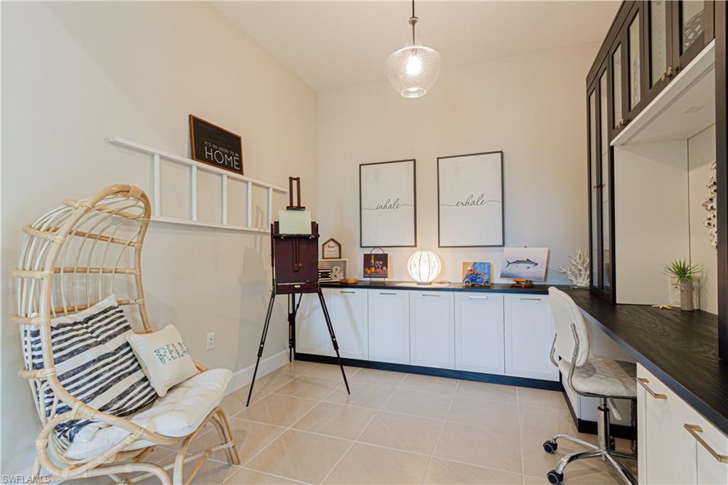 5834 Haiti Drive Naples, FL 34113 - Photo 5 of 33 a living room with furniture and a flat screen tv