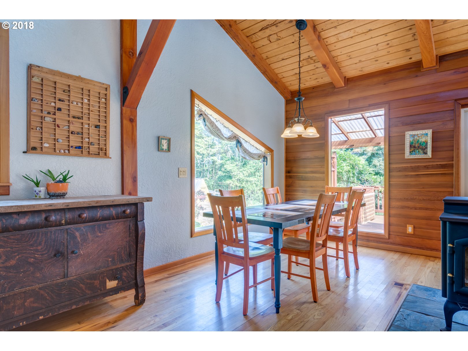66794 Doetsch Road Deer Island, OR 97054 - Photo 11 of 32 a view of a dining room with furniture window and wooden floor