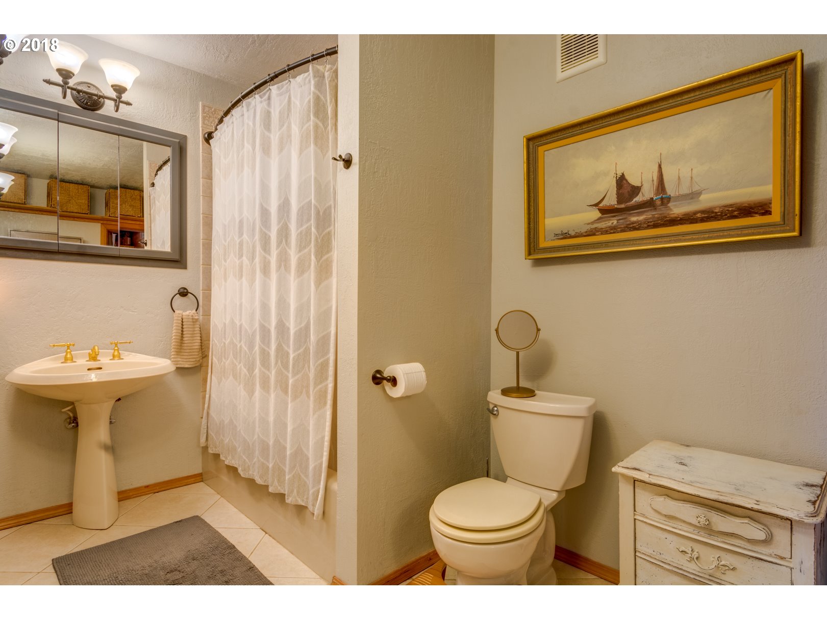 66794 Doetsch Road Deer Island, OR 97054 - Photo 16 of 32 a bathroom with a toilet sink and mirror