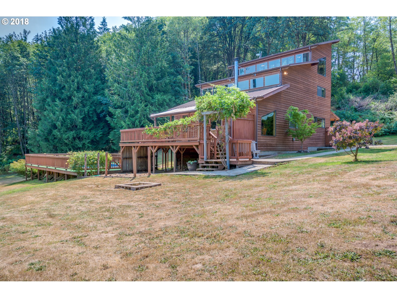 66794 Doetsch Road Deer Island, OR 97054 - Photo 28 of 32 a front view of house with yard and trees in the background