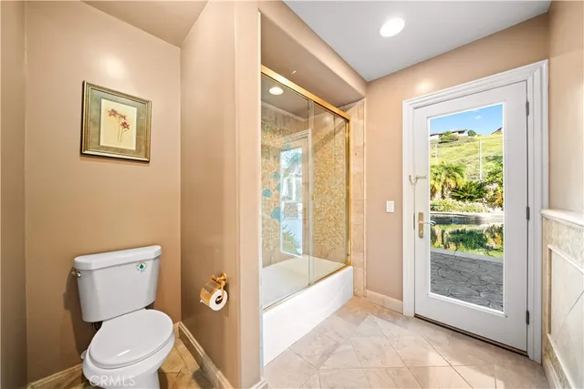 a view of balcony with wooden floor and fence