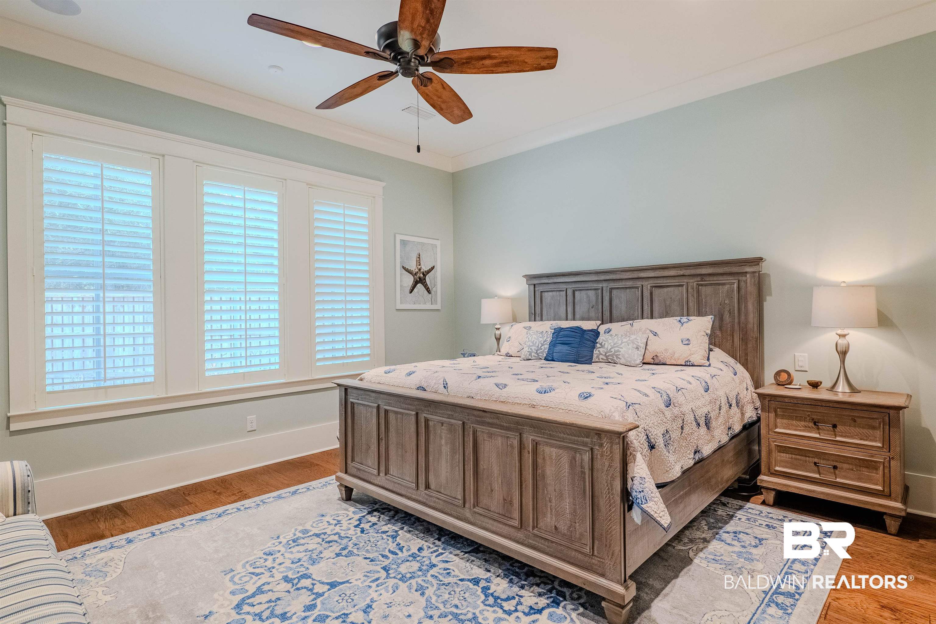 708 Manning Place Fairhope, AL 36532 - Photo 22 of 58 Bedroom with crown molding, wood-type flooring, and ceiling fan