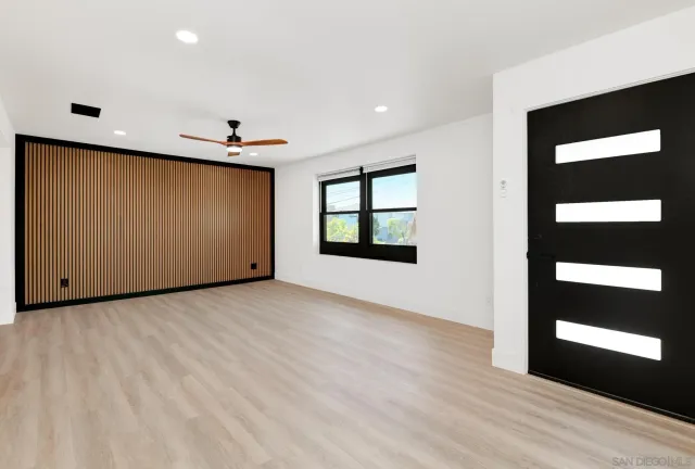 a view of an empty room with a window